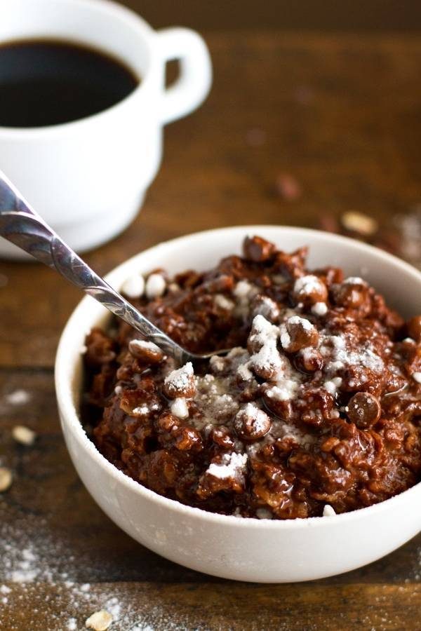 Double chocolate oatmeal in a white bowl with a spoon.