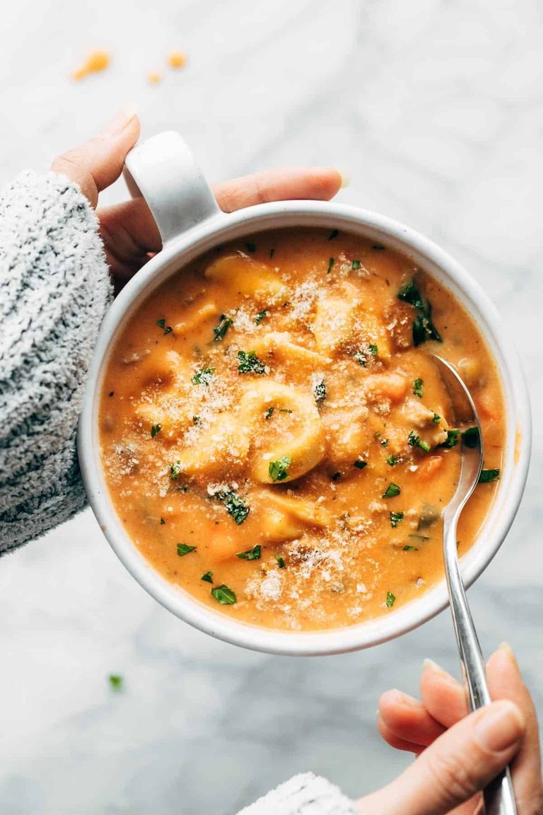 Tortellini soup in a bowl.