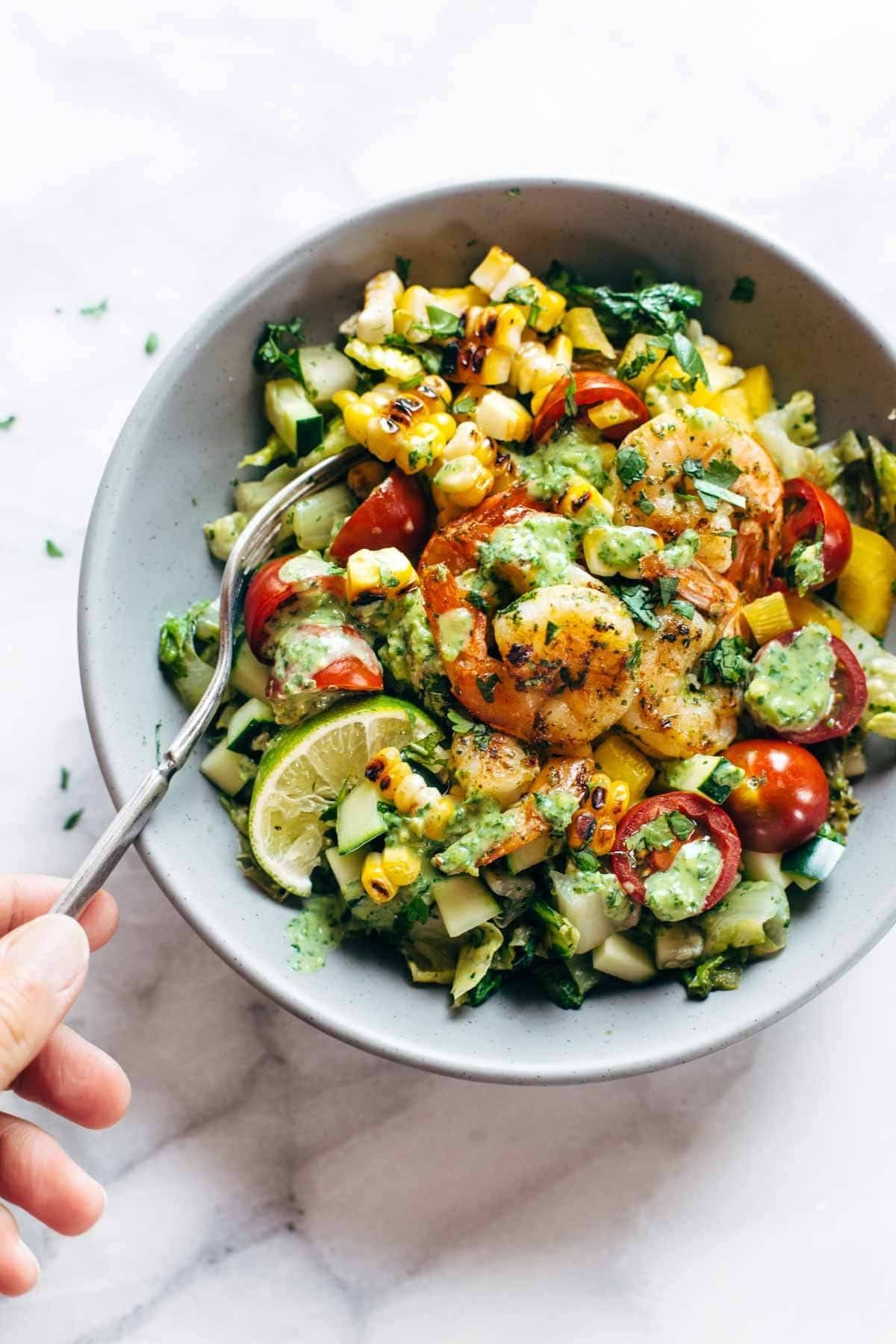 Salad in a bowl with a fork.