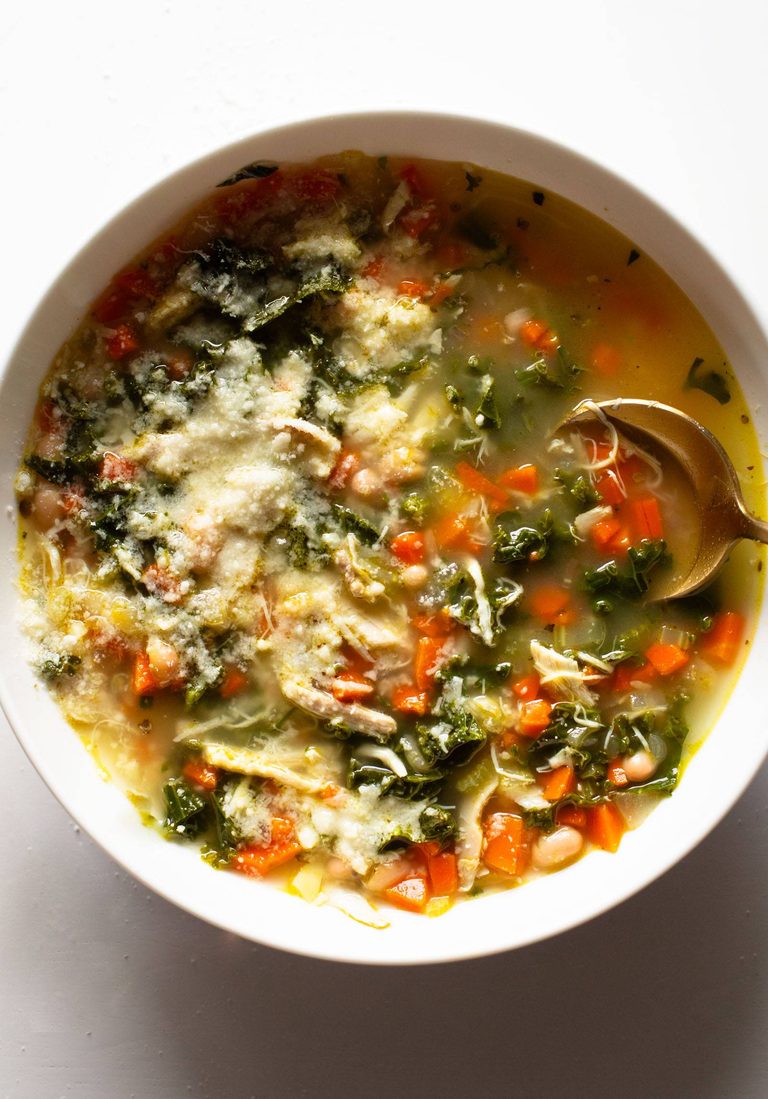 Lemon rosemary chicken soup in a bowl.