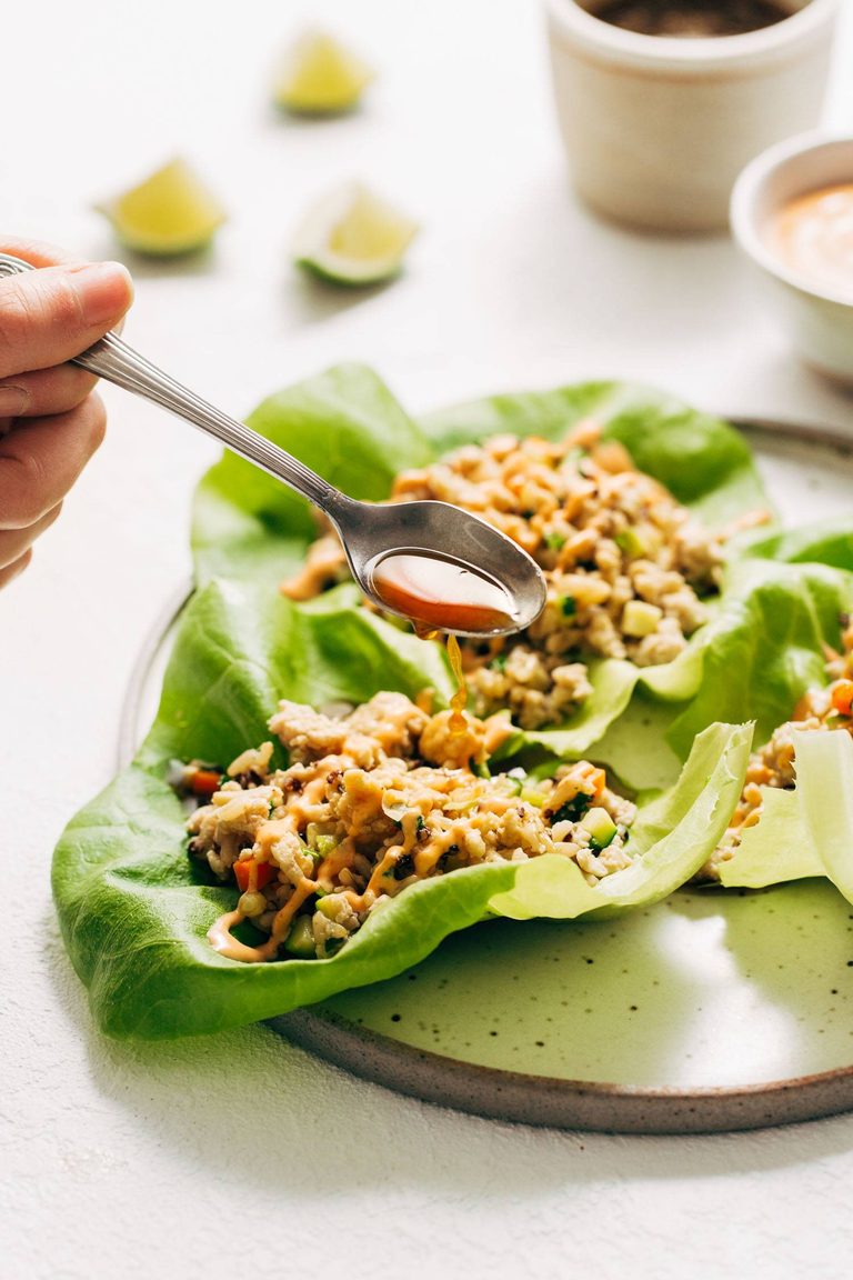 Chicken lettuce wraps with lime drench poured on top.