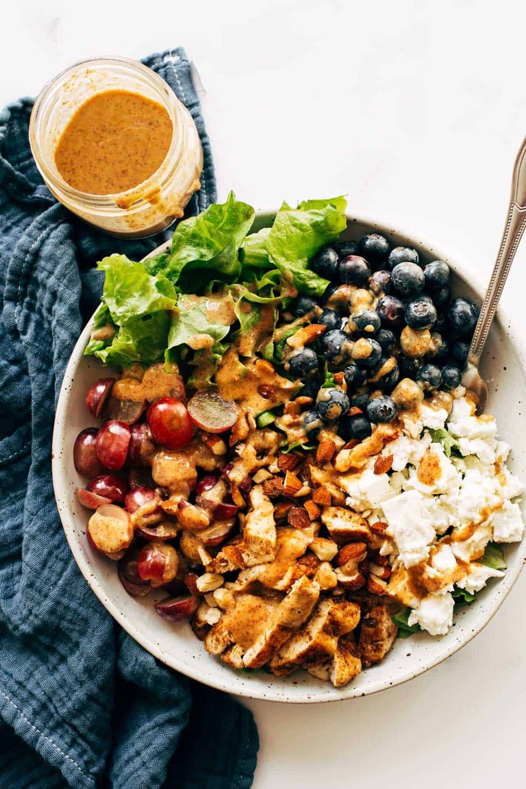 Rainbow chicken salad with berries and cheese.