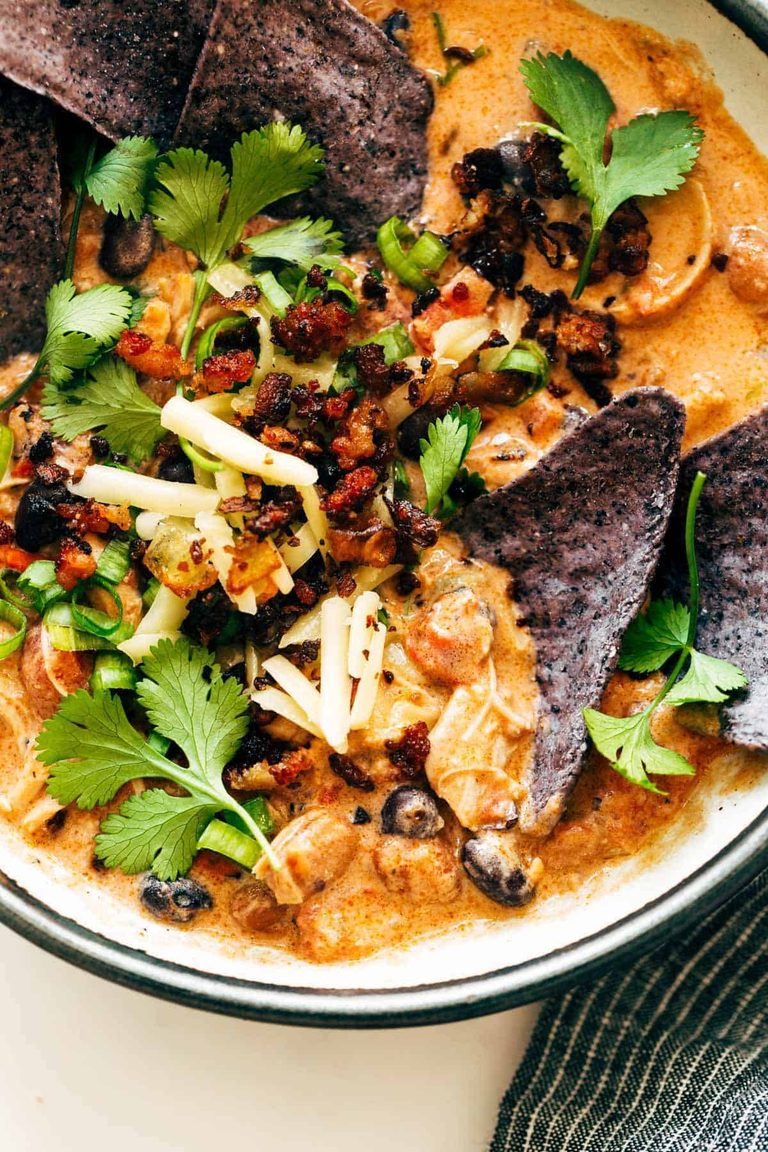 White chicken chili with chips in a bowl.