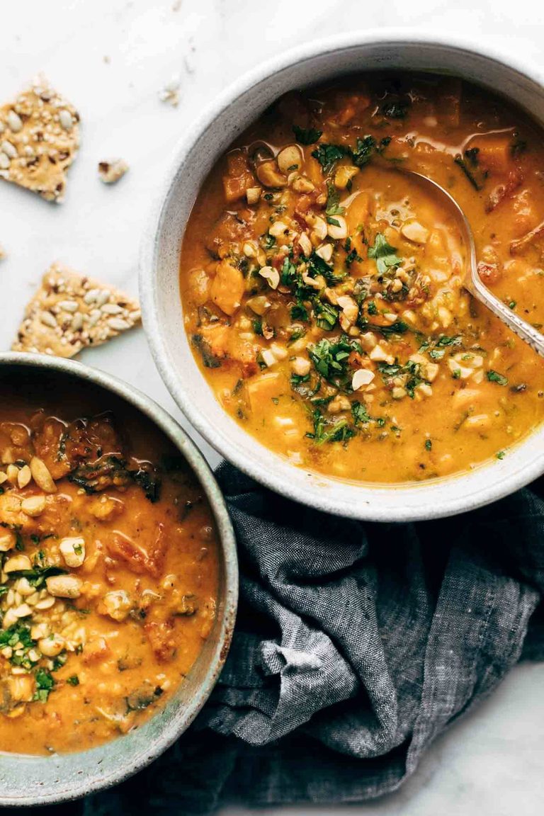Spicy peanut soup in bowls.