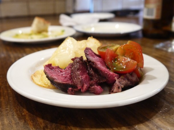 Beef onglet, fried potatoes and tomatoes at Copita onglet with fried potatoes and tomatoes at copita