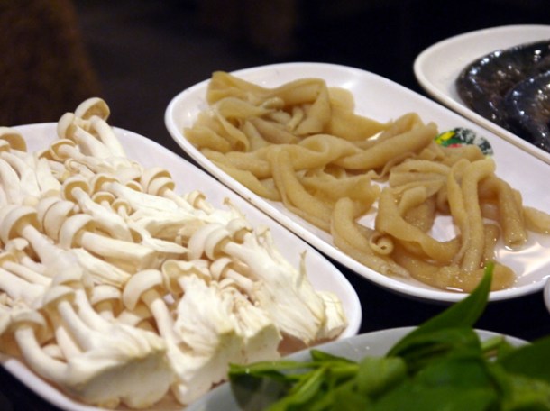 raw intestines and enoki mushrooms at Tian Xiang Huwei Hot Pot